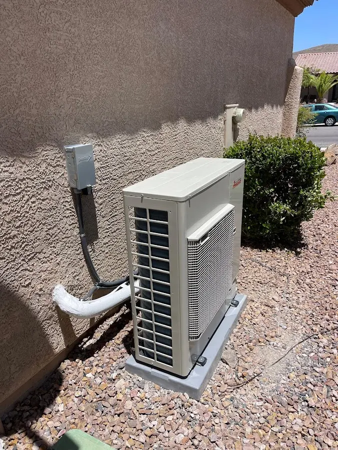Residential air conditioning condenser unit in Olivarez